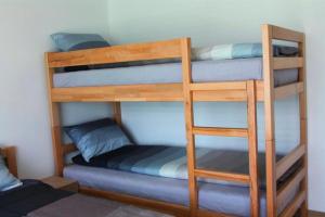 Ένα ή περισσότερα κρεβάτια σε δωμάτιο στο Hostel Sobe Popović