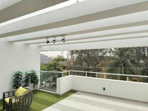 a room with a balcony with a large window at Dazzling Lekki 3BR Home - Private Balcony - 247 Power, Wifi & Security in Lekki