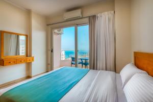 Postel nebo postele na pokoji v ubytování Delmar Apartments by Peaks