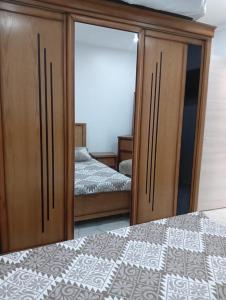 En eller flere senge i et værelse på Appartement cosy