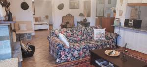 a living room with a couch and a table at Kineta Farmhouse in Kineta
