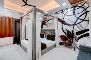 En eller flere senge i et værelse på Hotel O Sindhu Palace