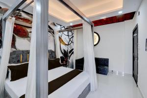 En eller flere senge i et værelse på Hotel O Sindhu Palace