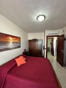 Ένα ή περισσότερα κρεβάτια σε δωμάτιο στο Appartamento Lido Vistamare