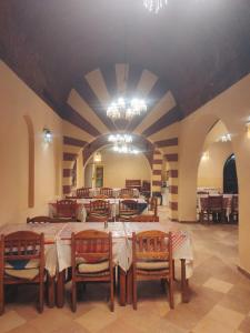 a large dining room with a table and chairs at Siwa Safari Paradise Hotel in Siwa +170 photos
