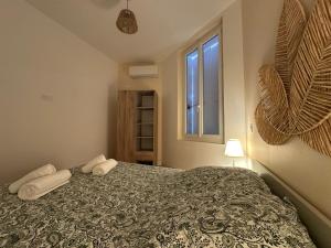 Ένα ή περισσότερα κρεβάτια σε δωμάτιο στο Le 37 FOCH