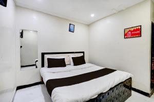 Una cama o camas en una habitación de HOTEL O METRO STAY 21 fotos más