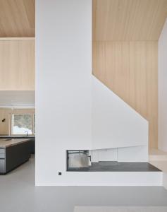 a kitchen with white walls and wooden cabinets at Z91 - Skandi-Architektenhaus mit Bergblick in Bad Mitterndorf