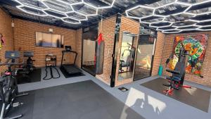 a room with a gym with bikes and a wall at Ajijic San Antonio Lake Chapala Villas - Pickleball Court - Gym in San Antonio