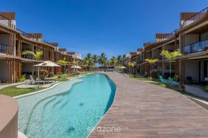 Πισίνα στο ή κοντά στο Apartamentos em Cond. com Piscina em Frente à Praia - NVB