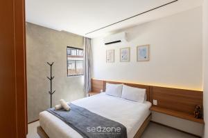 Ένα ή περισσότερα κρεβάτια σε δωμάτιο στο Apartamentos em Cond. com Piscina em Frente à Praia - NVB +16 φωτογραφίες