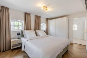 Ένα ή περισσότερα κρεβάτια σε δωμάτιο στο Duin en Daal