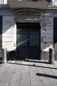 a building with a large door on the side of it at La dimora del Sole in Ercolano