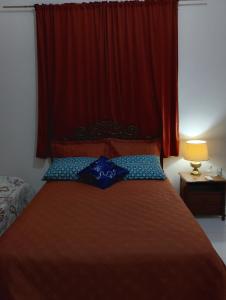 Ένα ή περισσότερα κρεβάτια σε δωμάτιο στο Jomar family home