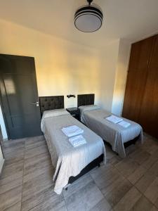 Ένα ή περισσότερα κρεβάτια σε δωμάτιο στο Apart's Sobremonte - Deptos Modernos