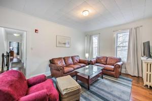 a living room with two couches and a table at Roomy Lancaster Home Walk to Dtwn and Hospital in Lancaster