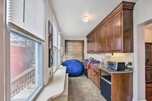 a kitchen with a sink and a large window at Roomy Lancaster Home Walk to Dtwn and Hospital in Lancaster