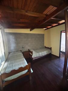 Postel nebo postele na pokoji v ubytování Cabañas EzeNic