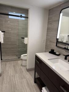 a bathroom with a sink and a toilet and a mirror at Lajitas Golf Resort in Terlingua +24 photos