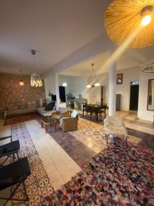 a large living room with a large rug at The Bay House Essaouira in Essaouira