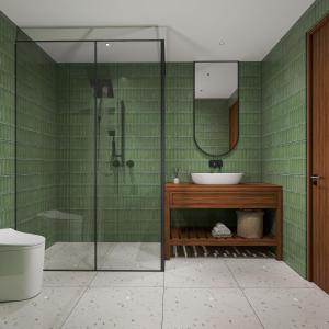 a bathroom with a glass shower and a sink at Aayovea Hotels & Resorts, Ayodhya in Ayodhya