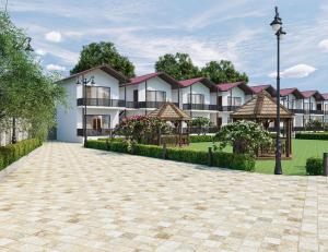 a rendering of an apartment building with a driveway at Aayovea Hotels & Resorts, Ayodhya in Ayodhya