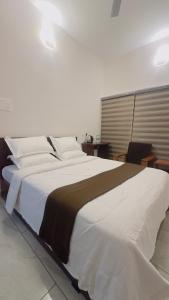 Postel nebo postele na pokoji v ubytování TAMARA VISTA Executive Homestay