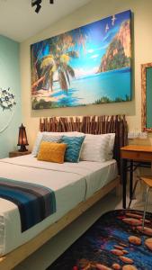 Ένα ή περισσότερα κρεβάτια σε δωμάτιο στο Bayside & Beach Inn Langkawi