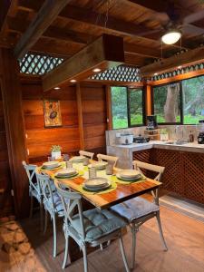 a dining room with a wooden table and chairs at Casa Oropéndola Refugio natural en Guanacaste in Bagaces +26 photos