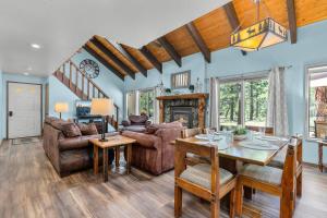 a living room with a table and a dining room at Leisure Lane 4 in Sunriver