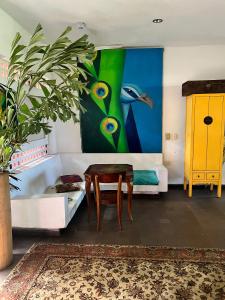 a living room with a couch and a table at Hotel Selva HQ in Palomino