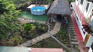 an aerial view of a backyard with a swimming pool at Hotel Paradise in Isla Fuerte