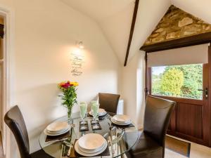 a dining room with a glass table and chairs at 2 Bed in Newton-on-Rawcliffe 88957 in Newton