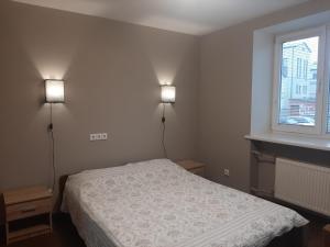 Ένα ή περισσότερα κρεβάτια σε δωμάτιο στο Тоmiк Liepaja