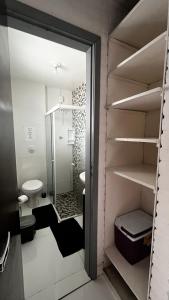 a bathroom with a walk in shower and a toilet at Casa do Point in Saquarema +84 photos