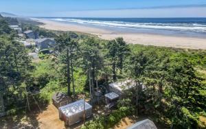 an aerial view of a house and the beach at Twin Rocks Retreat in Rockaway Beach