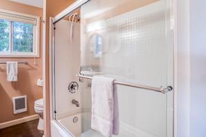 a bathroom with a shower and a toilet at Twin Rocks Retreat in Rockaway Beach +52 photos