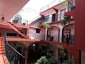 a group of buildings with balconies and plants on them at Hotel kasa Sarita Centro Historico SMA in San Miguel de Allende
