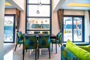 a dining room with a table and chairs at Villa Unique 2 in Fethiye