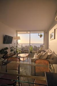 Μια τηλεόραση ή/και κέντρο ψυχαγωγίας στο Depto Ocean View Algarrobo Norte - Piscina, WiFi y Estacionamiento