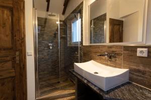 a bathroom with a sink and a glass shower at Haus-Elena in Bestwig