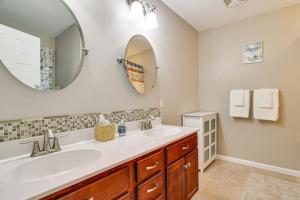 a bathroom with a sink and a mirror at Fire Pit, Games and Outdoor Fun! Poconos Retreat in Blakeslee +31 photos
