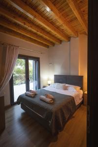 Ένα ή περισσότερα κρεβάτια σε δωμάτιο στο Vincenzo Villa Variko