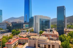 a view of a city with tall buildings at Apartamentos Costanera Centre in Santiago +37 photos