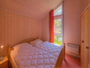 Postel nebo postele na pokoji v ubytování Ferienhaus mit Sauna im Ferienpark Mirow