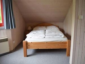 Ένα ή περισσότερα κρεβάτια σε δωμάτιο στο Ferienhaus im Ferienpark Mirow