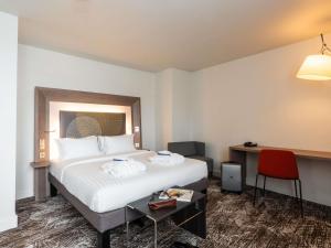 Postel nebo postele na pokoji v ubytování Novotel Paris Gare De Lyon