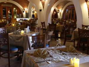 a restaurant with tables and chairs in a room at Beach safari suites &expedition in Marsa Alam City