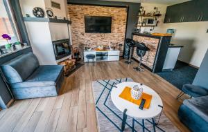 a living room with a couch and a table at Gorgeous Home In Slavonski Brod With Sauna in Podvinje