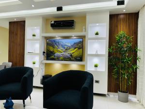 Μια τηλεόραση ή/και κέντρο ψυχαγωγίας στο Apartamento a solo 2 minutos de la Playa los Almendros